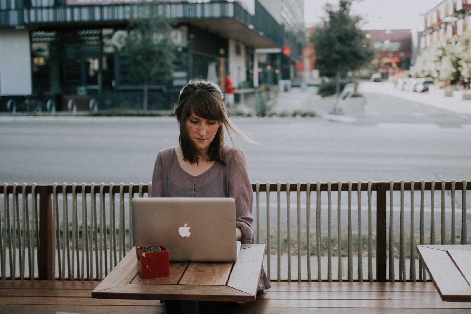 Woman working on her laptop outdoors