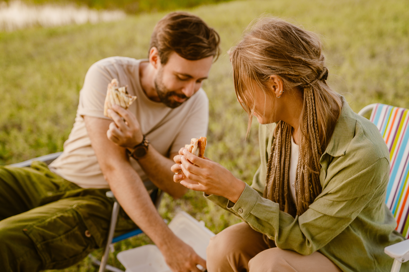 A family enjoying a simple and delicious lunch of sandwich wraps on a camping trip