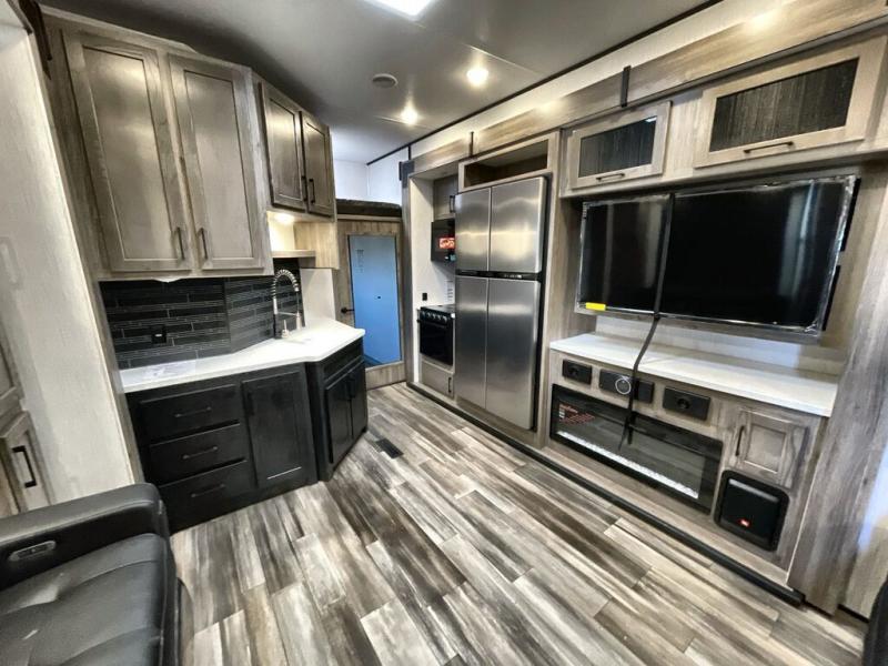 You’ll love that this toy hauler fifth wheel gives you an open and inviting layout.