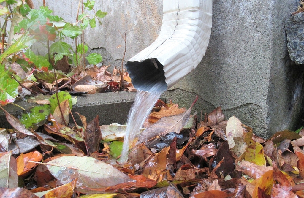 A downpipe carrying water away from the home.