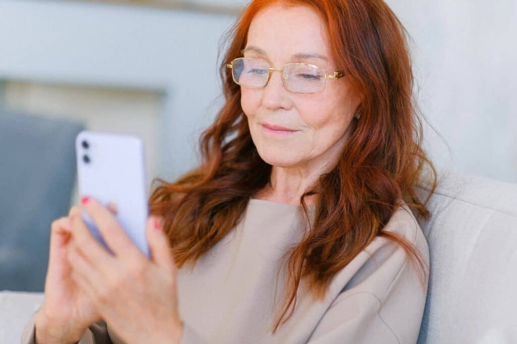 Old Woman Looking At Her Phone Stock