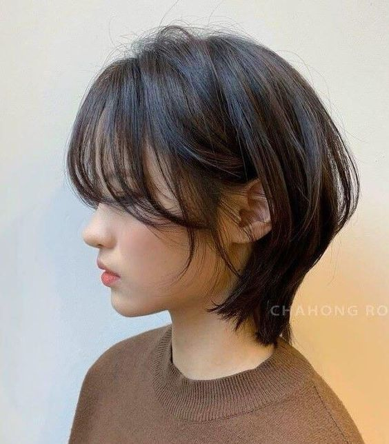 side view of Asian lady wearing short hair