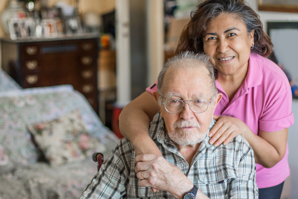 Senior man with his caregiver at home.