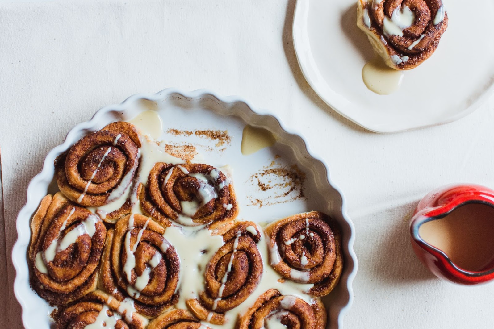 fresh cinnamon buns from one of kelowna's best bakeries, with drizzle on top