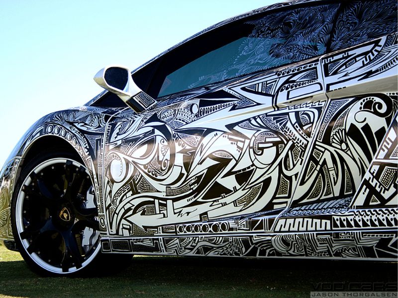 Lamborghini with eclectic sharpie-style drawings all along its body. 