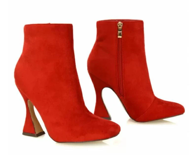 A pair of red high heeled shoes

Description automatically generated