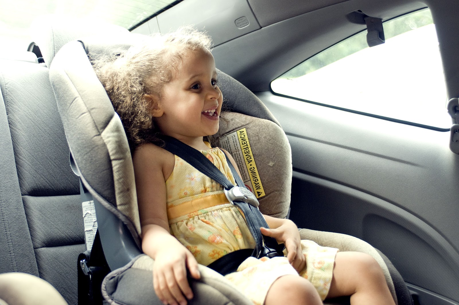 Little girl in a car seat