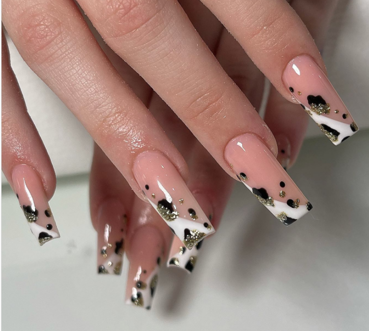 Cow print vibes, black and gold nail designs ideas