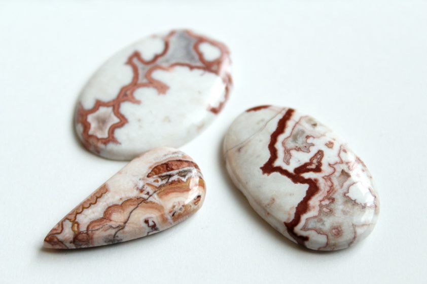 Crazy Lace Agate mineral (banded chalcedony, microcrystalline quartz) with red and brown frilly pattern, mined in Mexico.