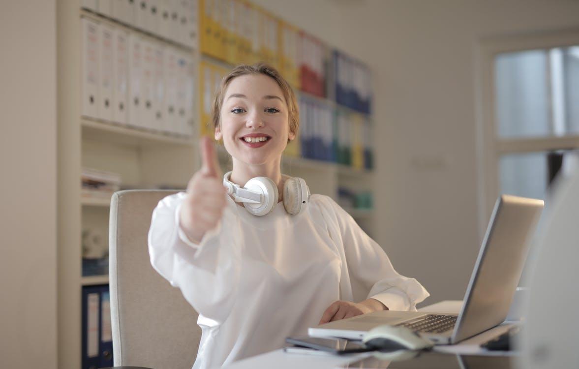 Free Woman Wearing White Top While Doing Thumbs Up Stock Photo