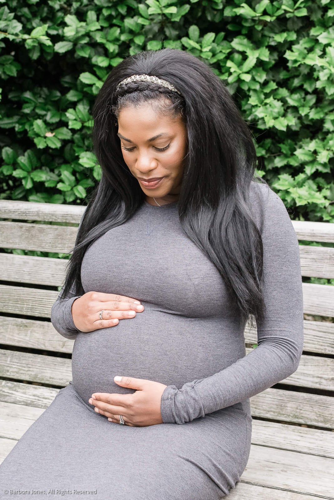 Pregnant woman sitting on a bench