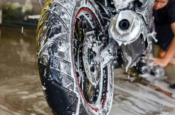 Motorcycle getting sudsy during wash