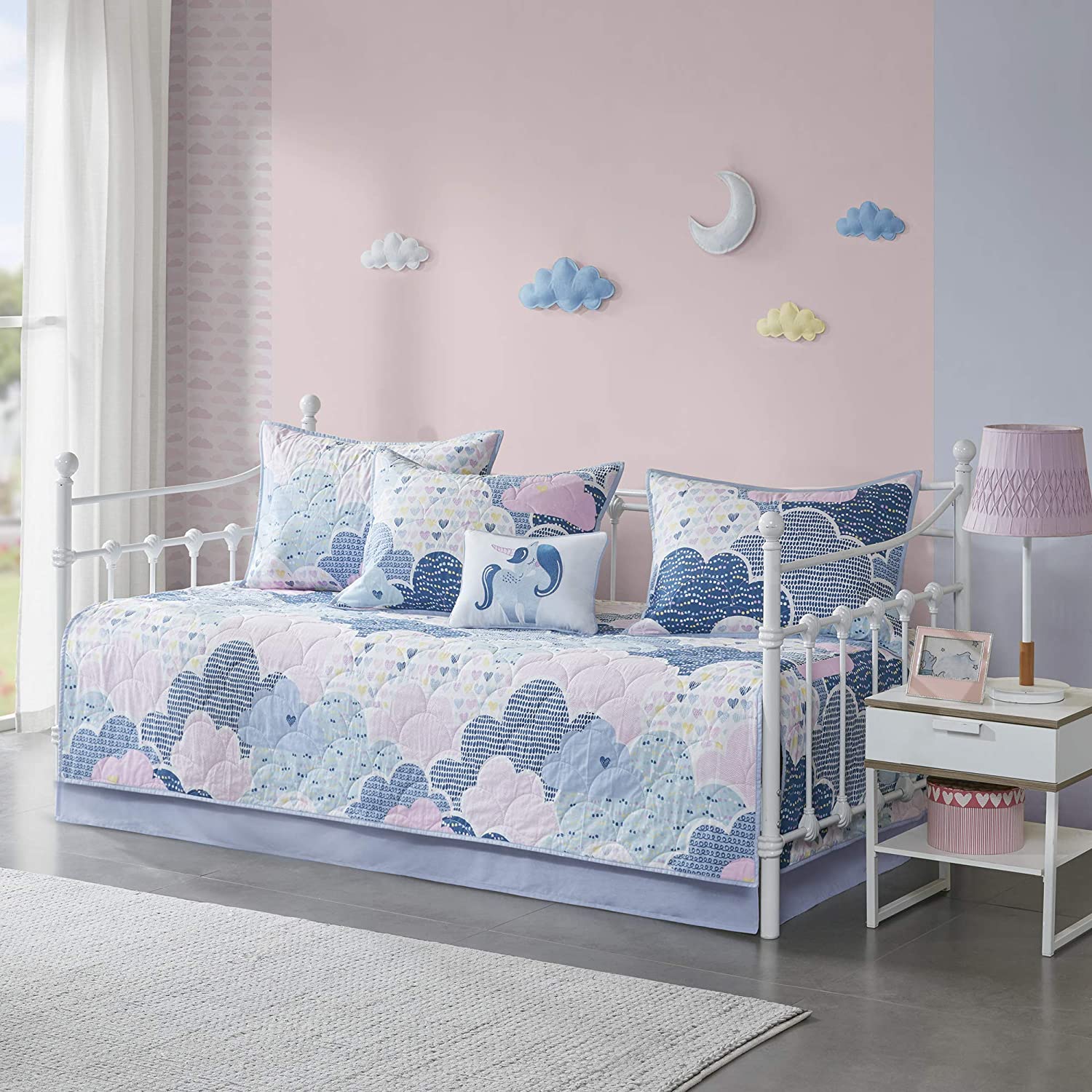 Adding a daybed with a trundle gives you more sleeping space in your nursery.