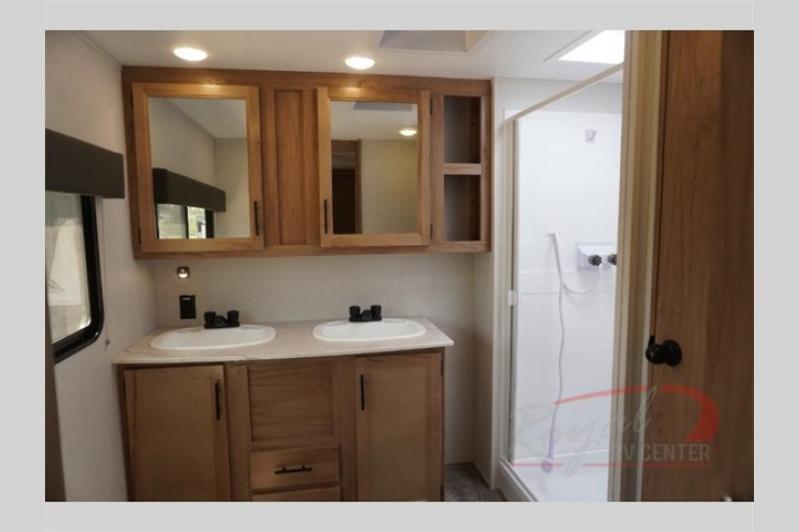 This bathroom feature is a dual vanity sink and spacious medicine cabinets for storage.