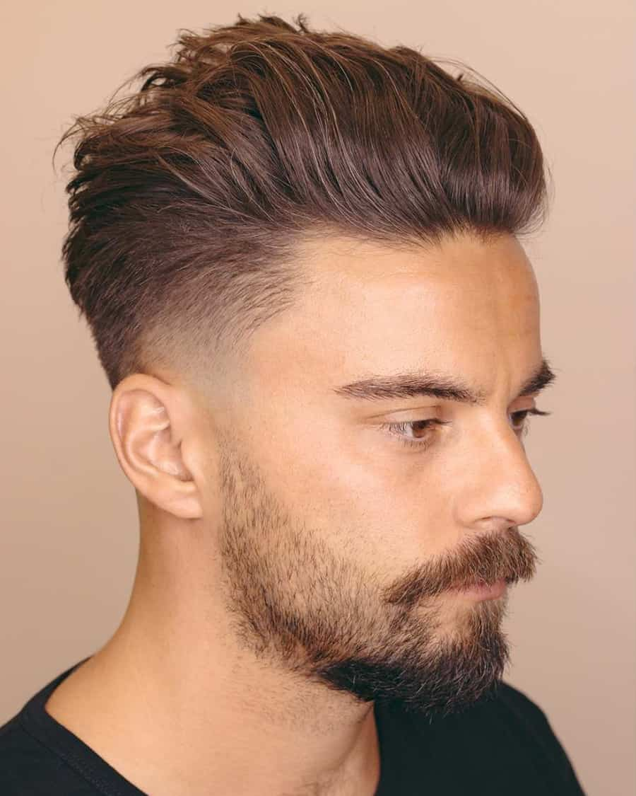 Full picture of a man rocking the pompadour with his hairdo