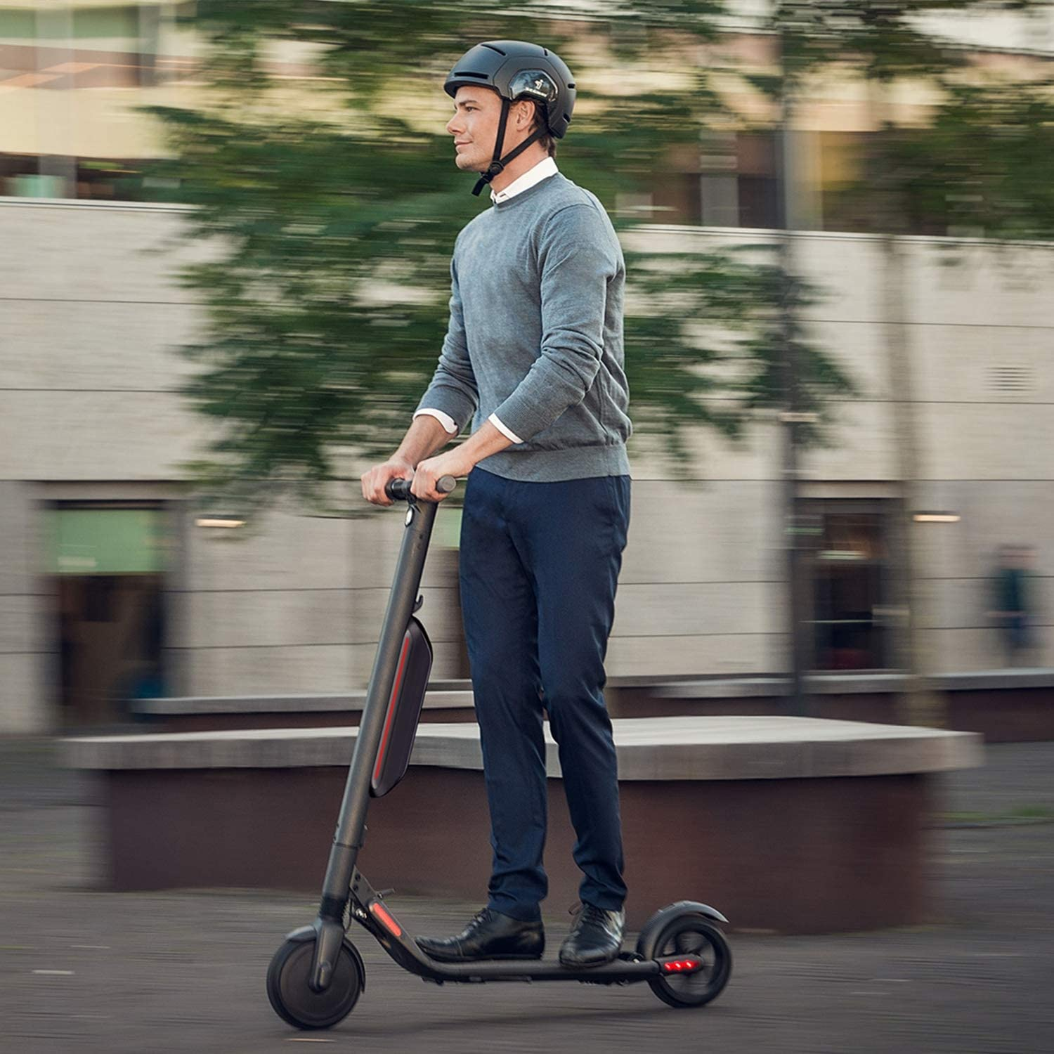 man riding a Segway Ninebot ES4 Electric Kick Scooter