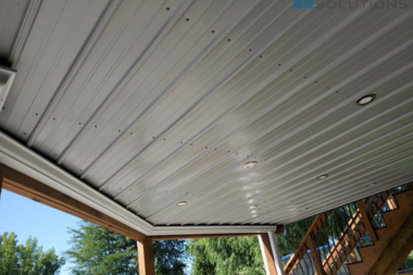 steel siding panels under decking drainage system outdoor living space