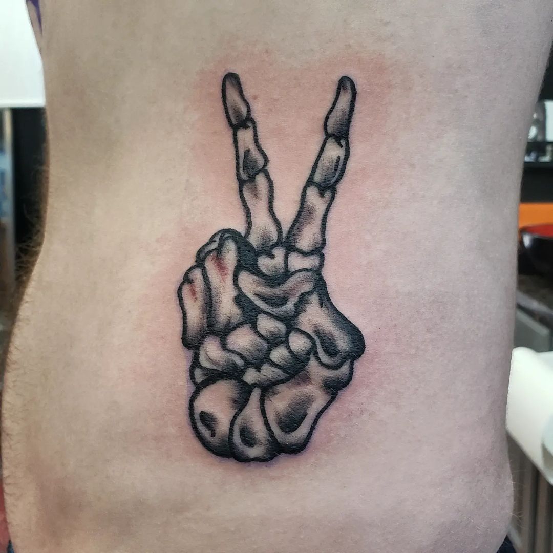 Skelly Hand Peace Sign Tattoo