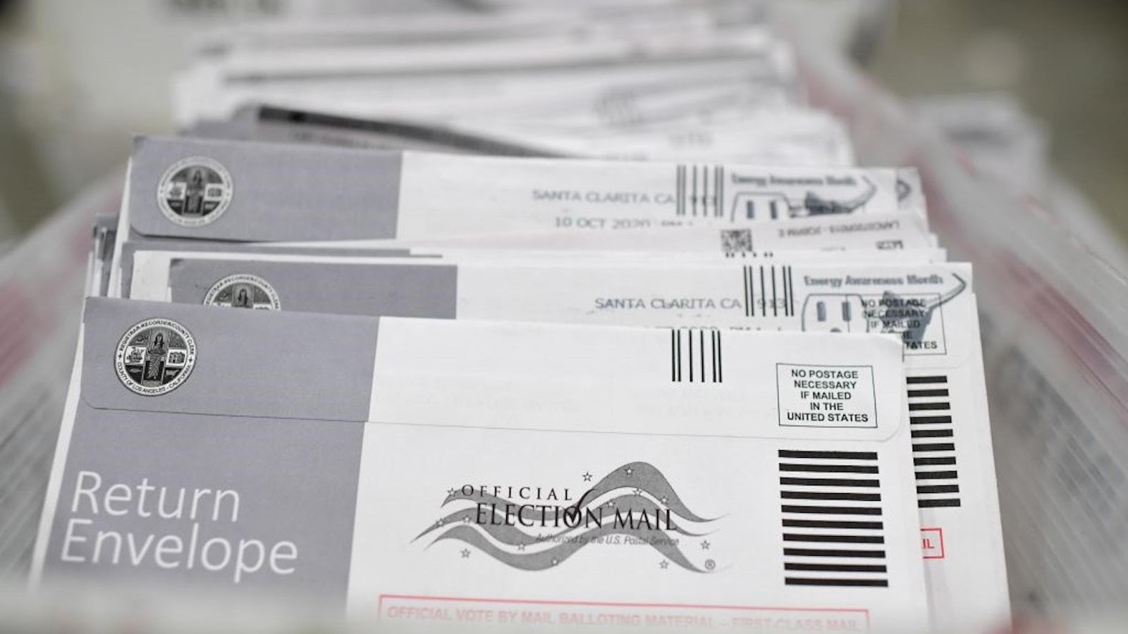 Mail-in ballots in their envelopes await processing at the Los Angeles County Registrar Recorders' mail-in ballot processing center at the Pomona Fairplex in Pomona, California, October 28, 2020.