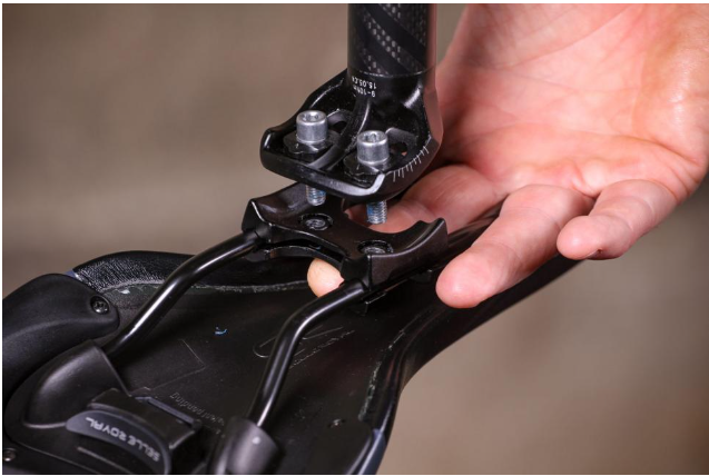 Make sure that the clamp head and saddle are reattached but loosely enough to adjust the saddle after cleaning.