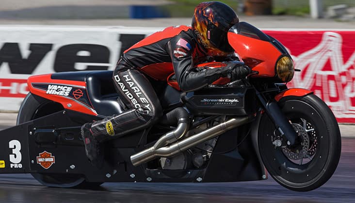 Harley Davidson racer taking off at race - adrenaline-fueled competition
