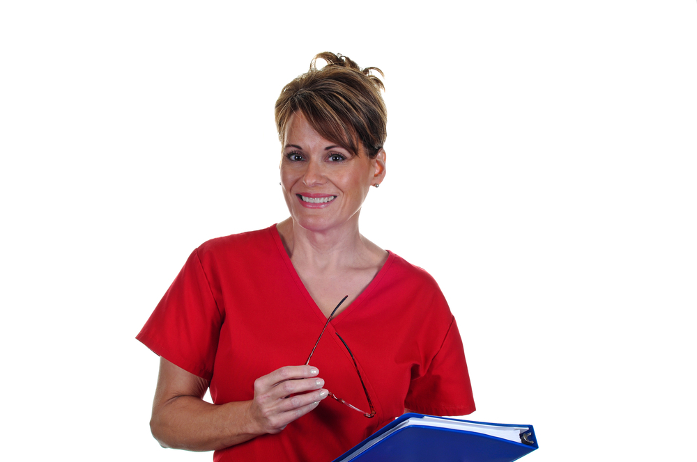 Nurse wearing red uniform and smiling 