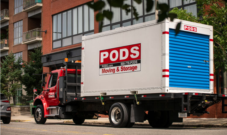 A PODS truck transporting a PODS moving and storage container through Boston, on its way to Milwaukee, WI