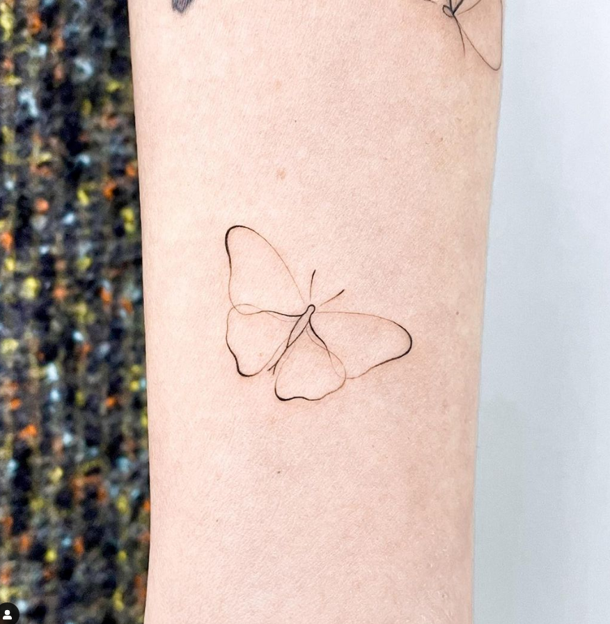 tiny butterfly minimalistic tattoo
