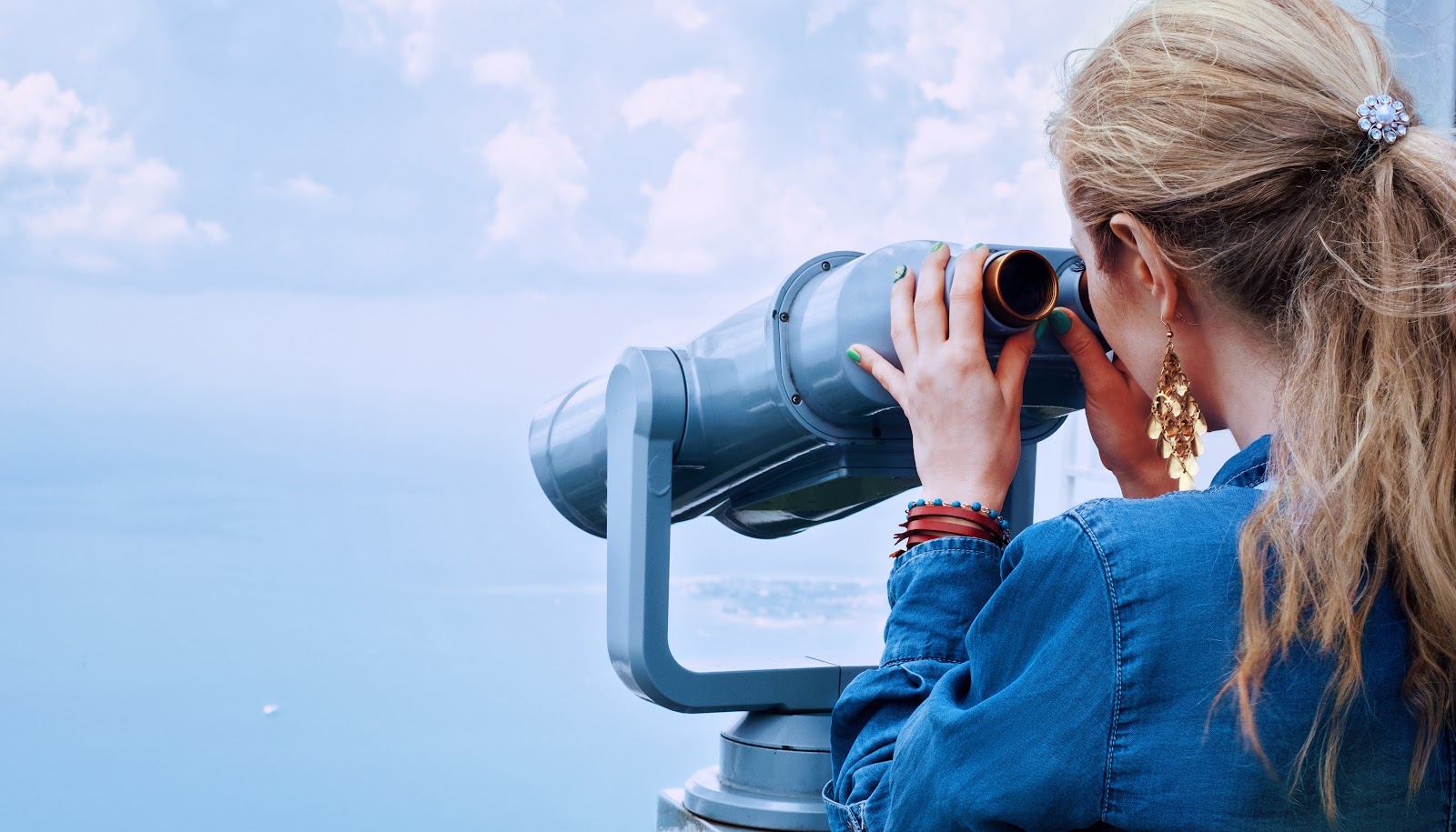 woman-looking-through-binoculars