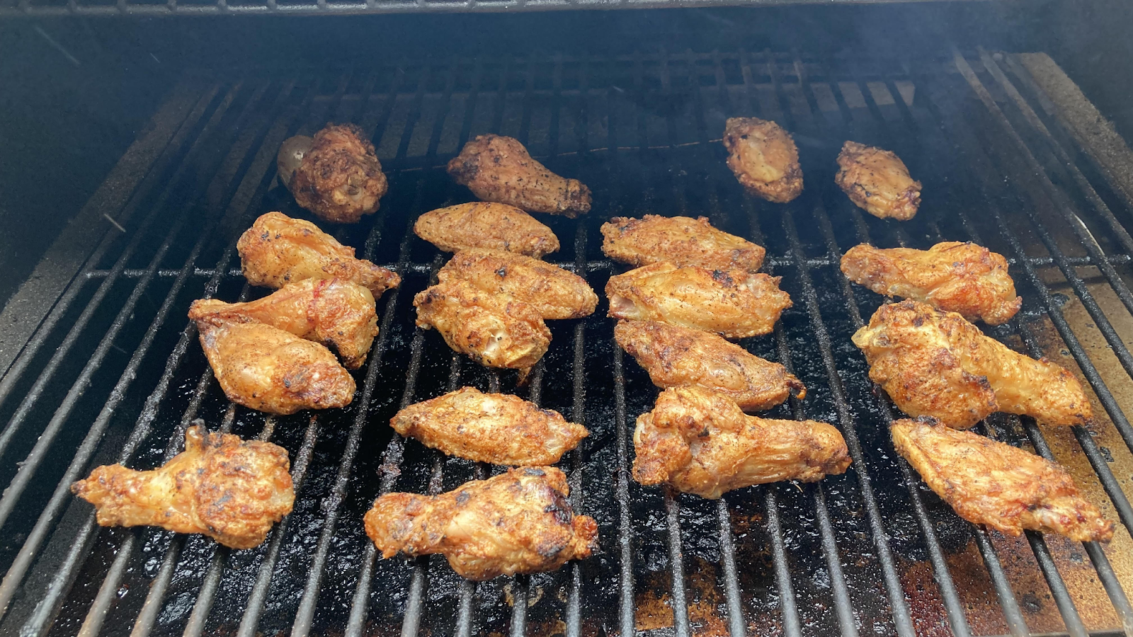 Griller's Gold Smoked Wings - chicken wings on the grill spaced evenly
