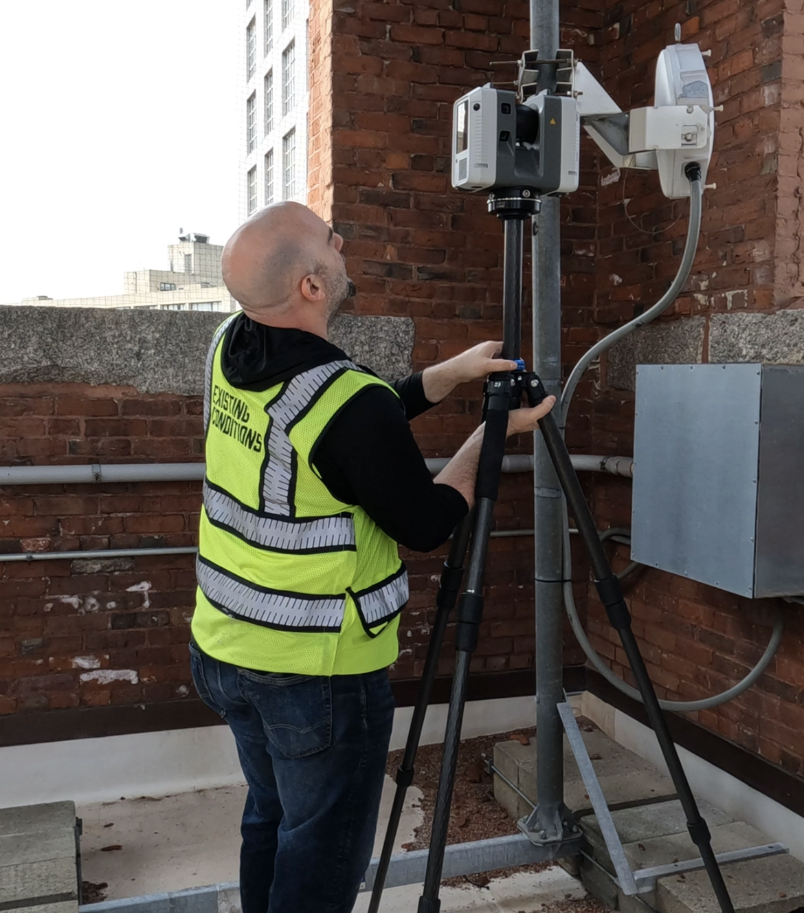 Mike Remond, Senior Operations Associate, utilizing the Leica RTC360 scanner on-site at St. Cecilia Parish
