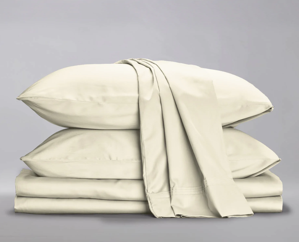 Tan bed sheets and pillows