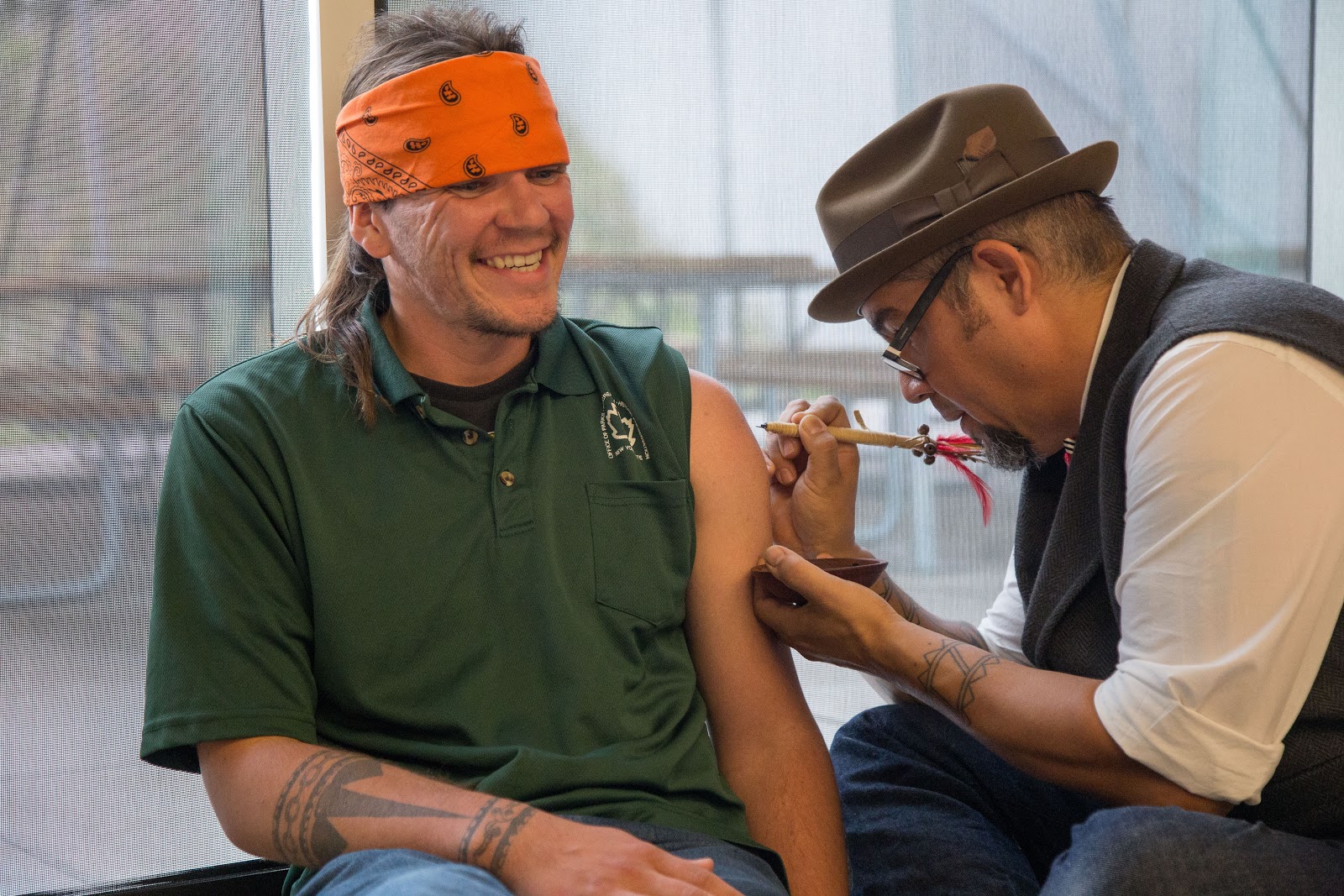 Elli Carr, Mohawk receiving his tattoo. He said it was a more comfortable experience than getting tattooed with an electric tattoo machine. Photo: Alex Hamer