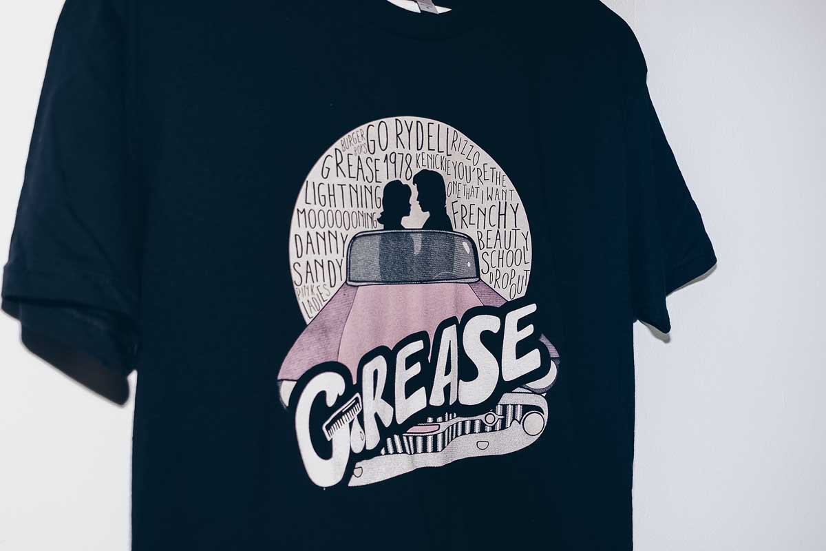 Old school vintage t shirt design of the theater play Grease screen printed with water-based discharge inks