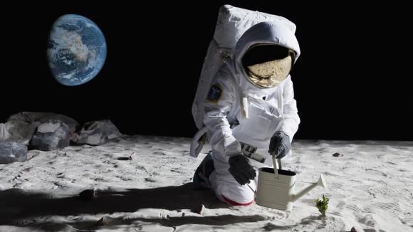 astronaut in space watering a plant