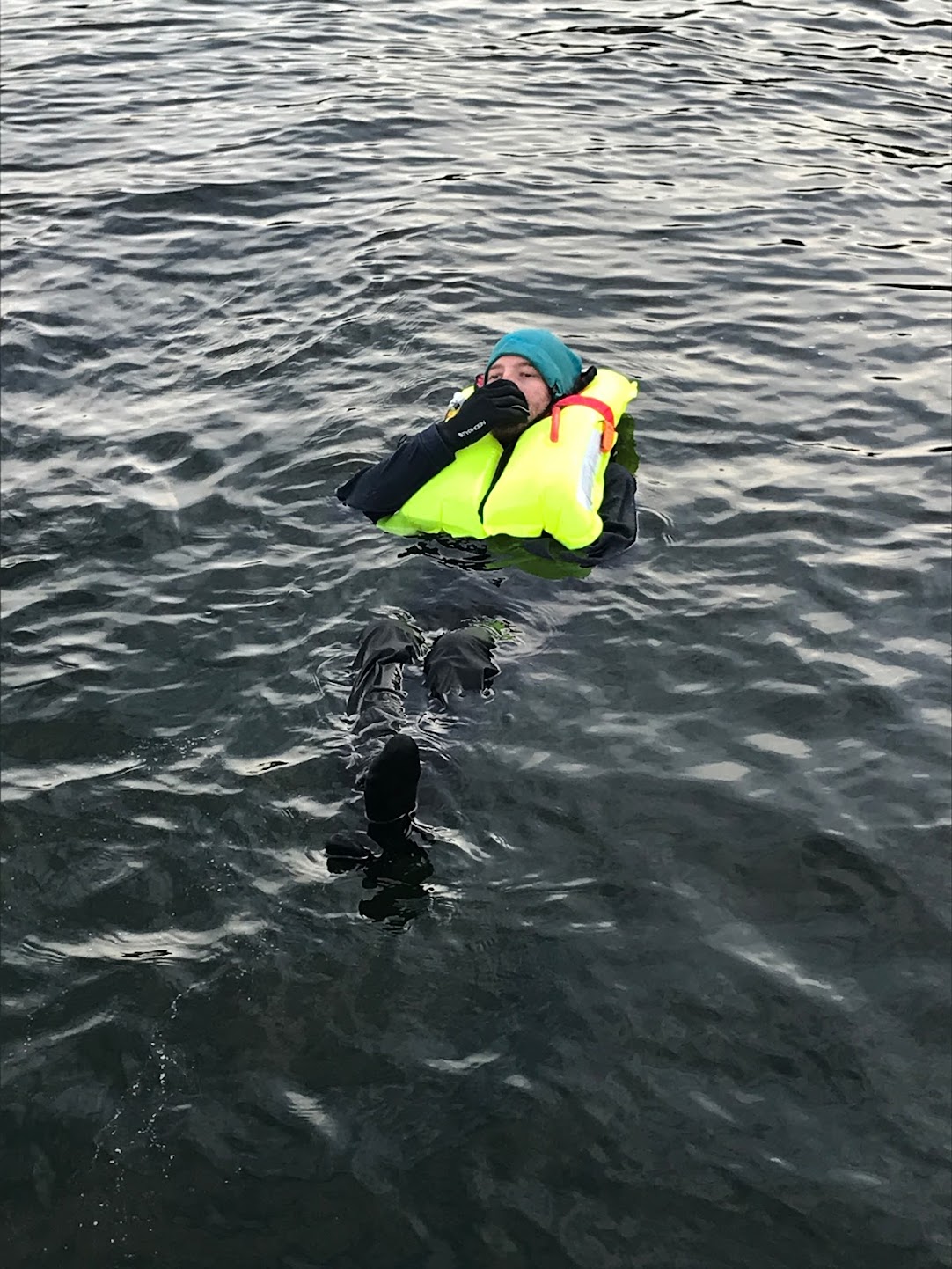 We don our lifejacket and demonstrate its use in our online RYA day skipper theory course.