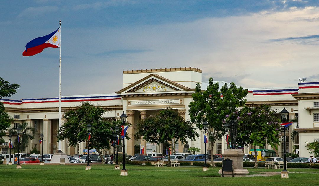 Government office in Pampanga with the Philippine flag in front of it.