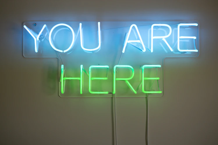 neon sign that says 'you are here on an article that focuses on mindfulness for insomnia.