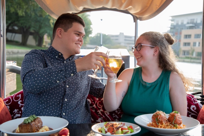 A couple dining on a gondola in Las Colinas, Irving, TX