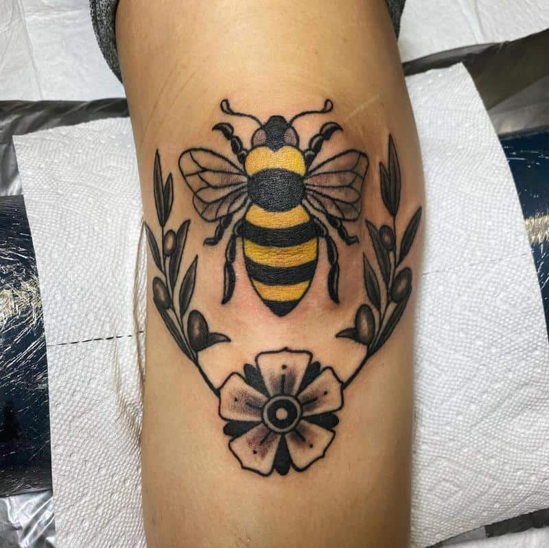 Another picture depicting a guy with colorful bee tat design