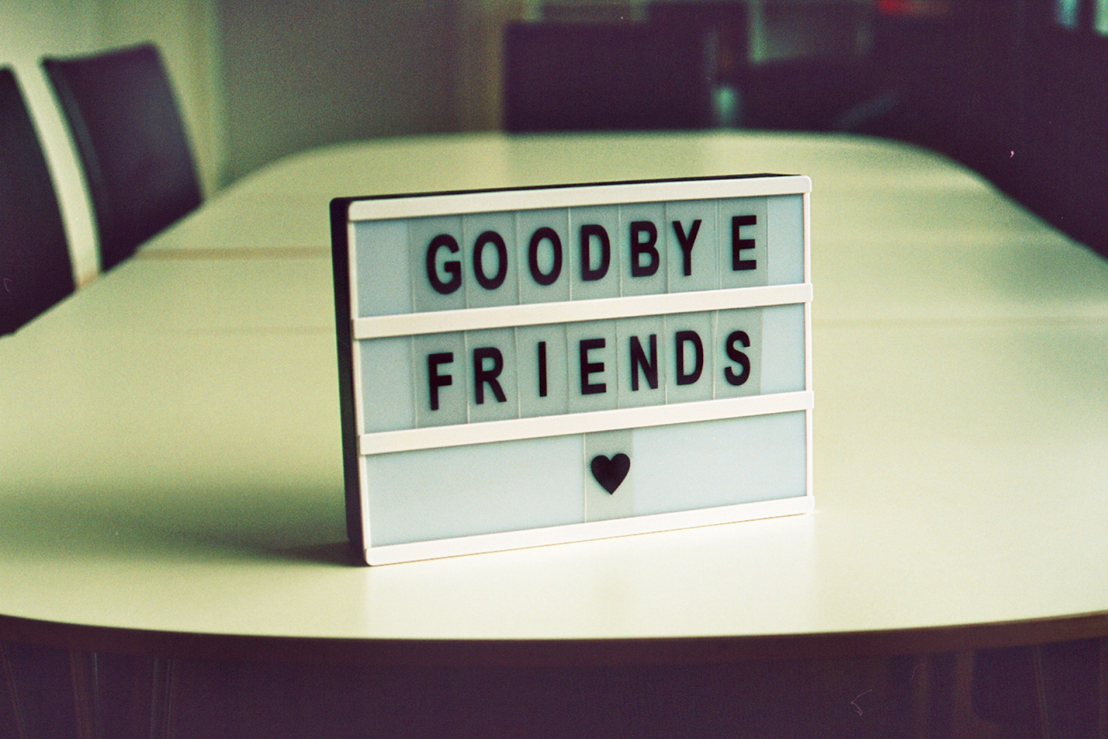 Sign on table displaying goodbye friends 