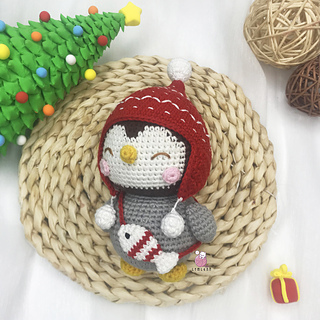 crochet penguin wearing red hat