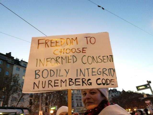 A person holding a sign

Description automatically generated with medium confidence