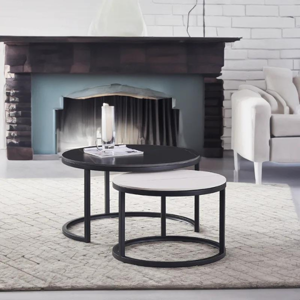 A black and white coffee table set with sintered stone top, supported by a metal frame.