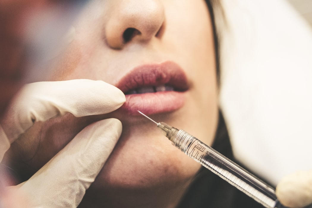 Women’s lips during Botox Injection