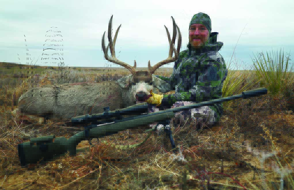 Chris Sells poses with the straight-pull Heym USA Carbon Precision and a good mule deer buck. Lightweight and well-balanced, the Carbon Precision is seriously accurate. 