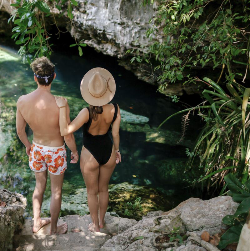 Guy and girl travel in Mexico and visit cenotes