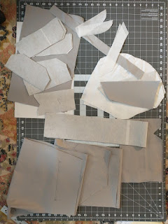 Pieces of fabric that will come together to become a single pair of cargo pants