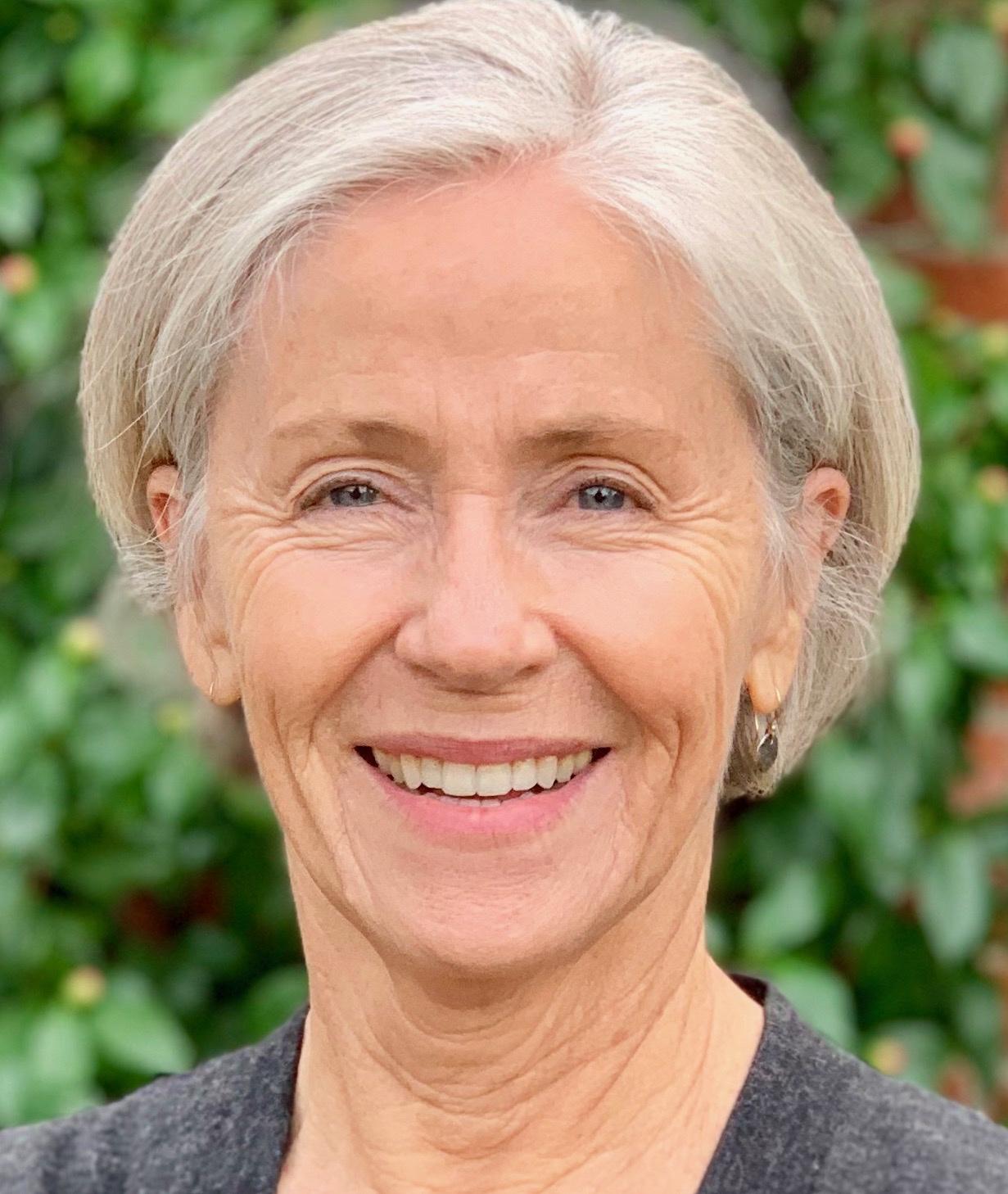 A person smiling for the camera
Description automatically generated