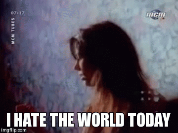 Meredith Brooks singing the lyrics to her feminist song "Bitch." The caption reads "I hate the world today."